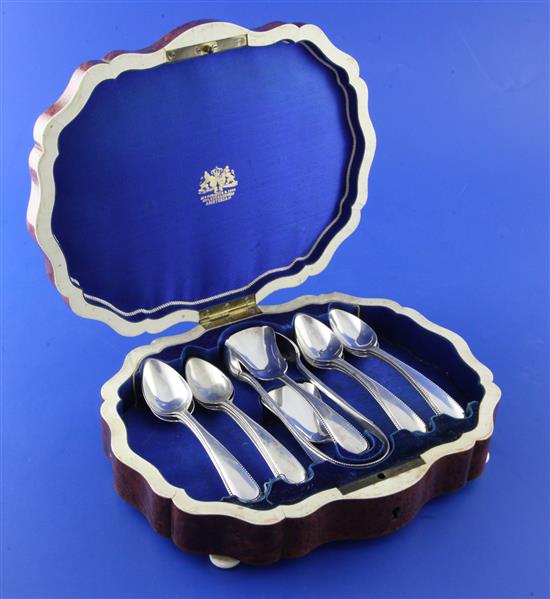 A matched set of twelve late 19th century Dutch 833 standard silver teaspoons, with sugar tongs, caddy spoon and preserve spoon.